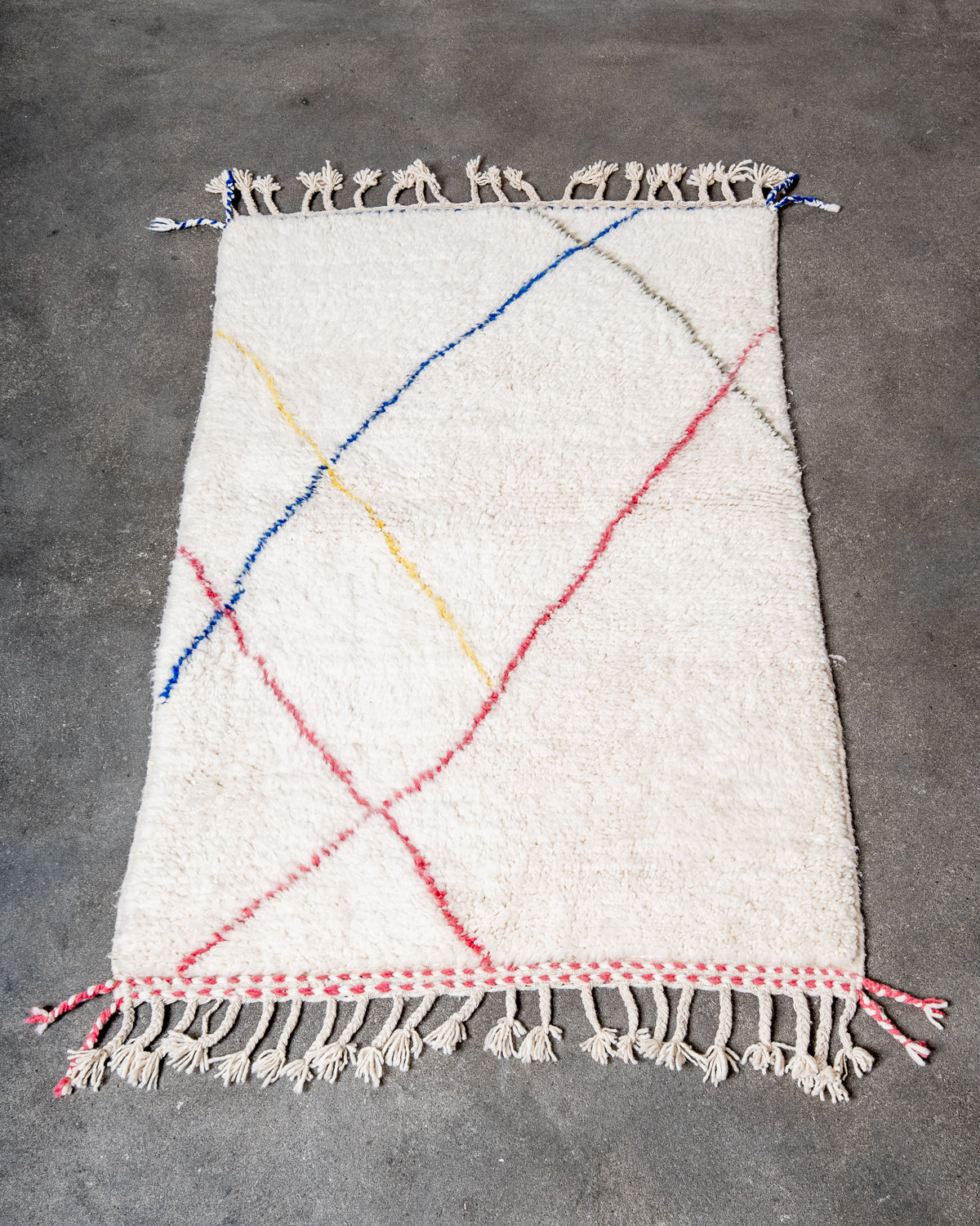 Modern, designer, handcrafted Berber rug from Morocco. Beniourain carpet with beautiful colours and patterns and fluffy wool texture.